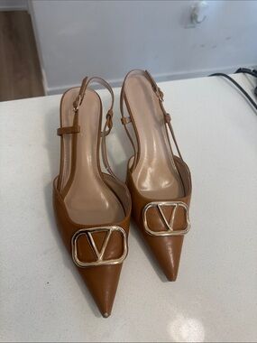 Pointed Tan Slingback Heels with Gold V Emblem